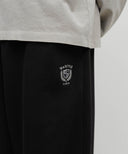 LOOSE FIT CREST SYMBOL SWEAT PANTS IN BLACK image 8