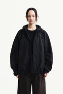 BACK LOGO HOODY WIND BREAKER IN BLACK