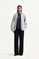 BACK LOGO HOODY WIND BREAKER IN LIGHT BEIGE