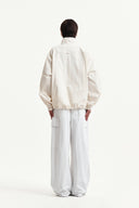 BACK LOGO HIGH NECK JUMPER IN CREAM