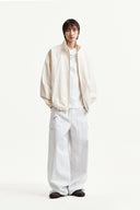BACK LOGO HIGH NECK JUMPER IN CREAM