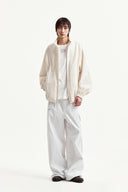BACK LOGO HIGH NECK JUMPER IN CREAM