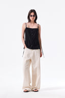 BUTTON SLEEVELESS BLOUSE IN BLACK