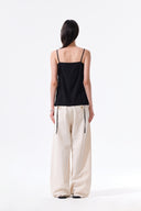 BUTTON SLEEVELESS BLOUSE IN BLACK