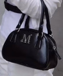 NAR METAL LOGO MINI CROSSBAG IN BLACK